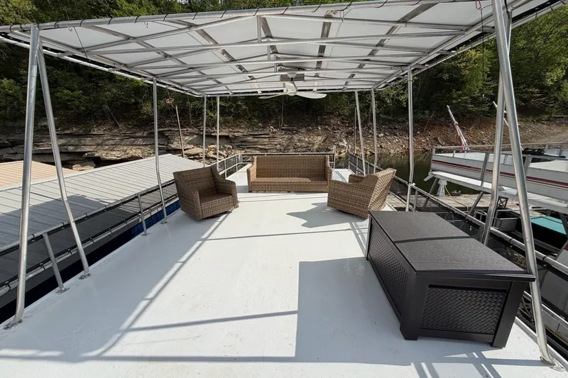 Slide: The Image of Upper deck of a 1989 Sumerset 14x63 houseboat with outdoor seating and canopy. - 33