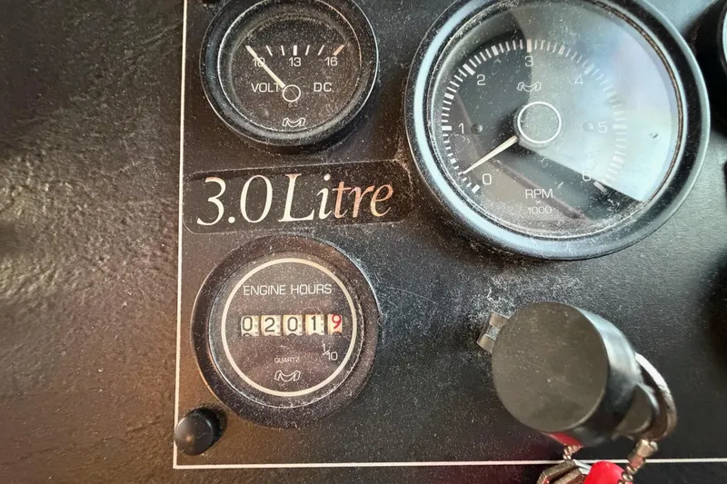 Slide: The Image of Close-up of 1989 Sumerset 14x63 engine panel showing gauges and 3.0 Litre label. - 9