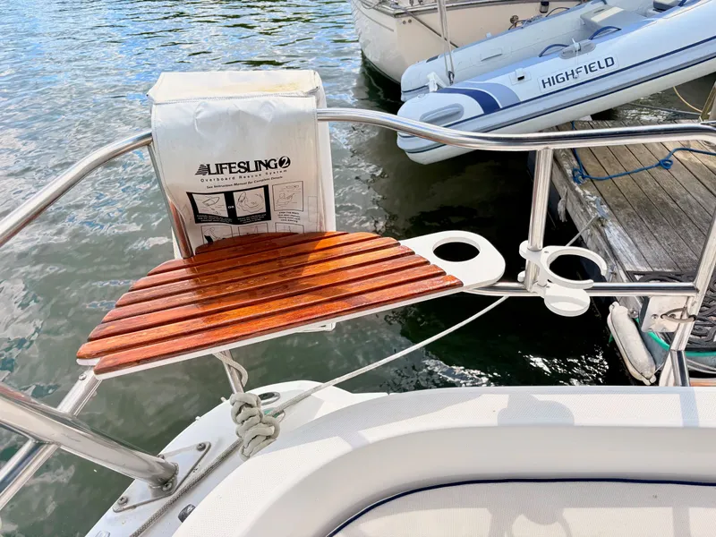 Slide: The Image of Hunter 356 boat with lifesling and wooden seat, year 2003. - 14