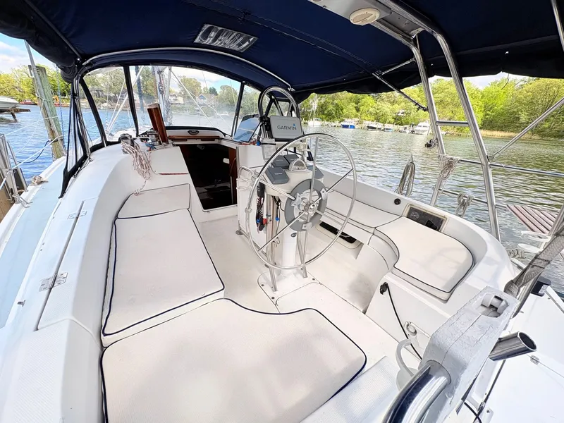 Slide: The Image of Interior view of a 2003 Hunter 356 sailboat by the water. - 15