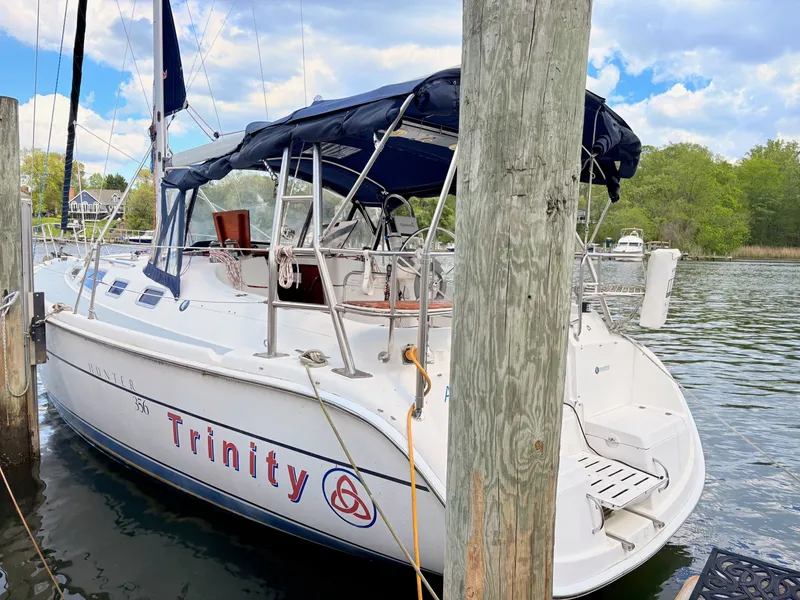 Slide: The Image of 2003 Hunter 356 sailboat "Trinity" docked at marina. - 16