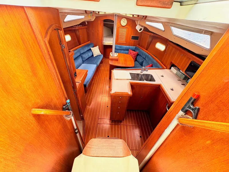 Slide: The Image of Interior of a 2003 Hunter 356 yacht with wooden furnishings. - 17