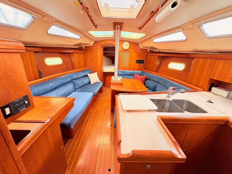 Slide: The Image of Interior of a 2003 Hunter 356 yacht with wooden furnishings. - 20