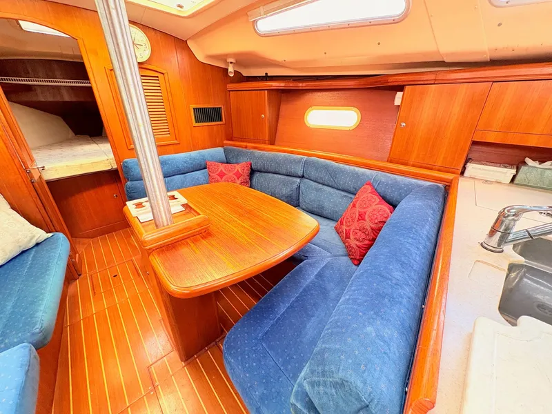 Slide: The Image of Interior of a 2003 Hunter 356 yacht with blue upholstery. - 22