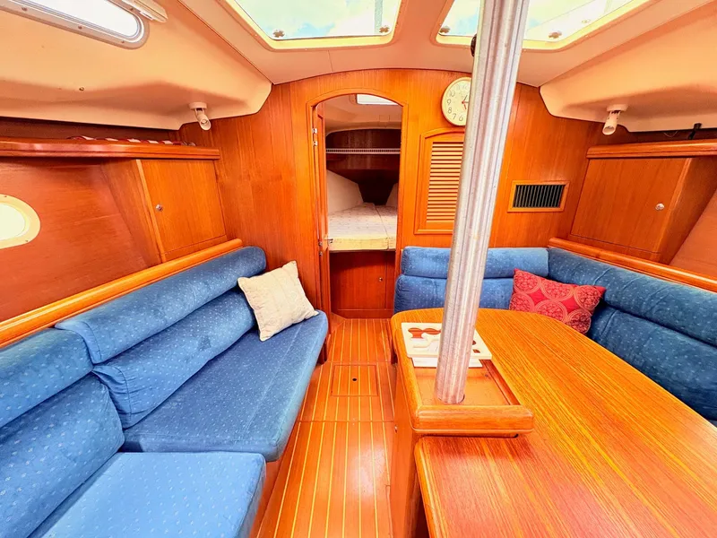 Slide: The Image of Interior of a 2003 Hunter 356 yacht with blue upholstery. - 23