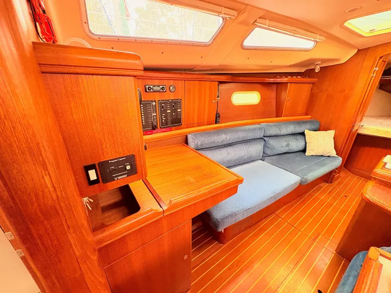 Slide: The Image of Interior of a 2003 Hunter 356 yacht with wooden furnishings. - 24