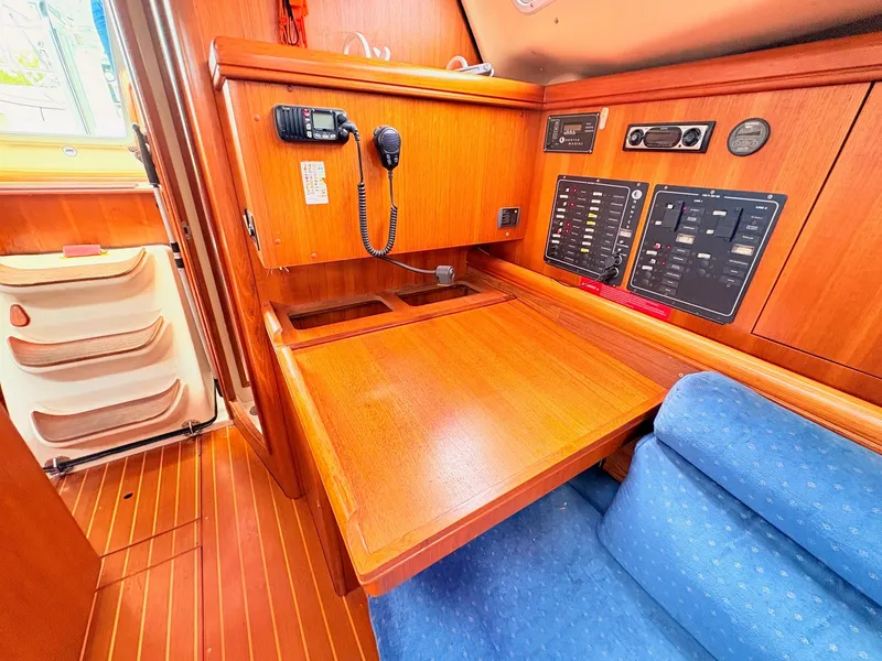 Slide: The Image of Interior of a 2003 Hunter 356 yacht with wooden furnishings. - 25