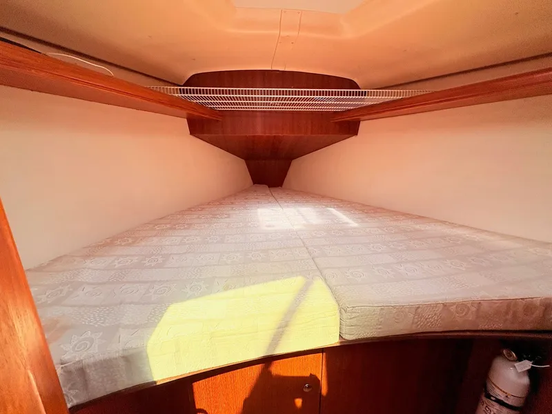 Slide: The Image of Interior of a 2003 Hunter 356 yacht with sleeping area. - 29