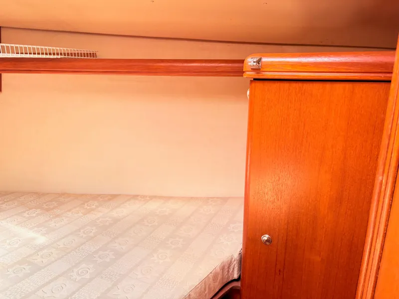 Slide: The Image of Interior of a 2003 Hunter 356 yacht with wooden furnishings. - 30