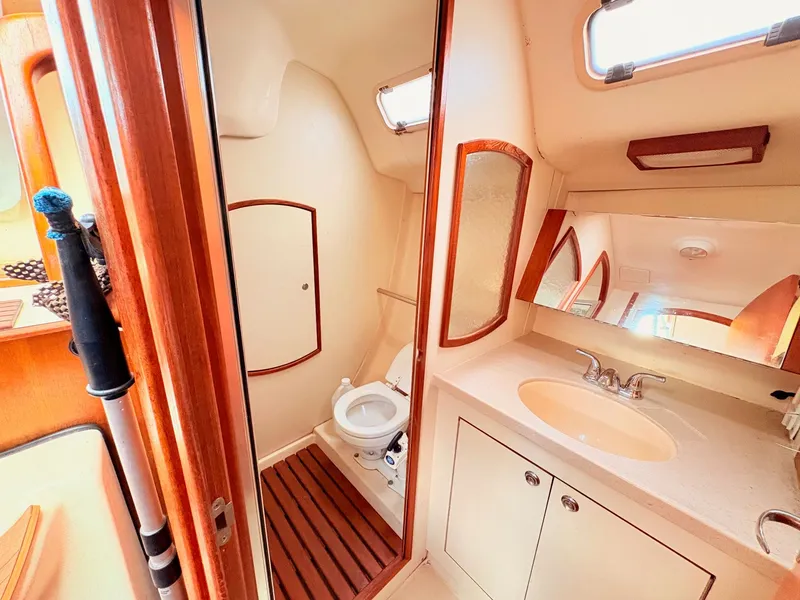 Slide: The Image of Interior view of a 2003 Hunter 356 yacht bathroom. - 34