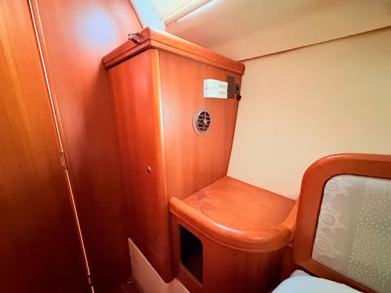 Slide: The Image of Interior of a 2003 Hunter 356 yacht with wooden cabinetry. - 37