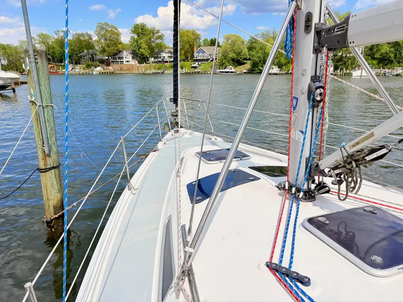 Slide: The Image of 2003 Hunter 356 sailboat on calm waters. - 4