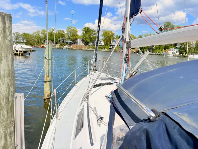 Slide: The Image of 2003 Hunter 356 sailboat docked on a sunny day. - 5