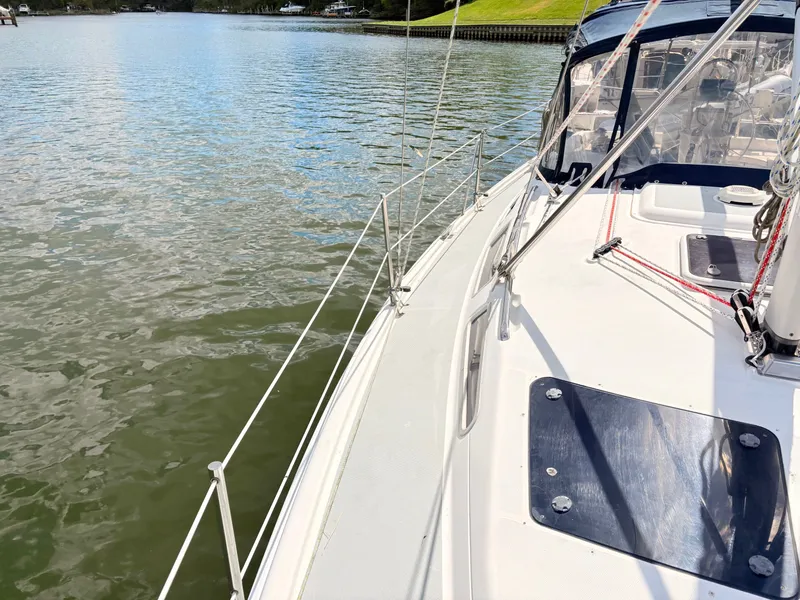 Slide: The Image of 2003 Hunter 356 sailboat on calm waters. - 7