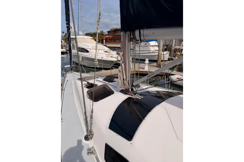 Slide: The Image of Sailboat deck view of 1998 Hunter Legend 40.5 in marina setting. - 11