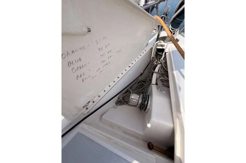 Slide: The Image of Anchor locker of 1998 Hunter Legend 40.5 sailboat with rope and chain storage. - 13