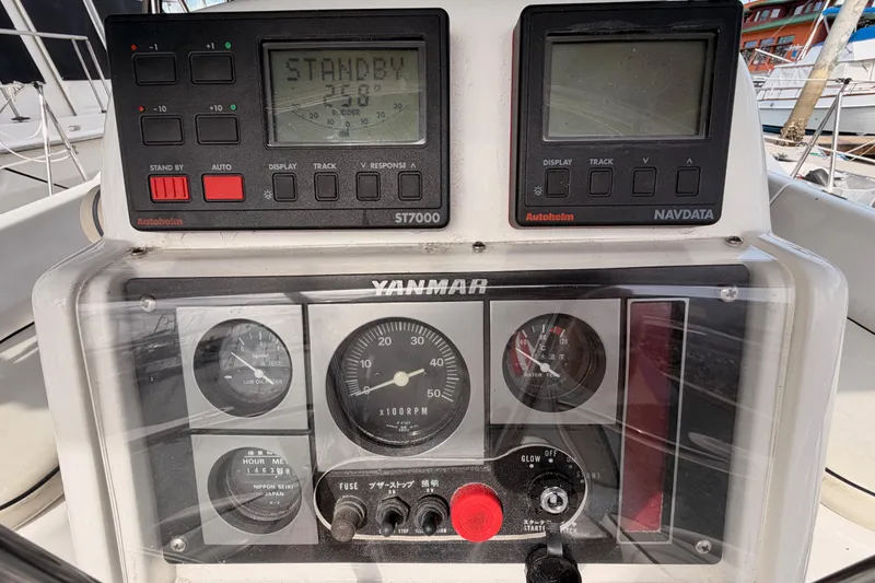 Slide: The Image of Control panel of a 1998 Hunter Legend 40.5 sailboat with Yanmar engine gauges. - 24