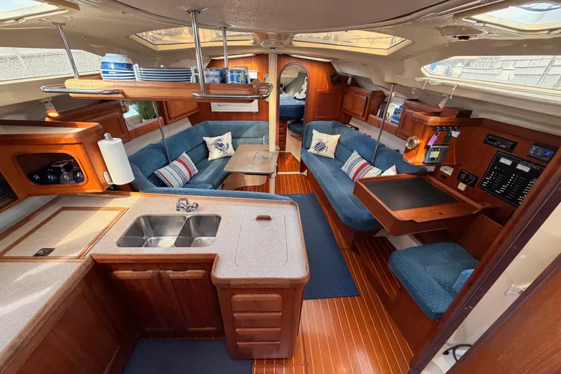 Slide: The Image of Interior of 1998 Hunter Legend 40.5 yacht with cozy seating and modern amenities. - 32