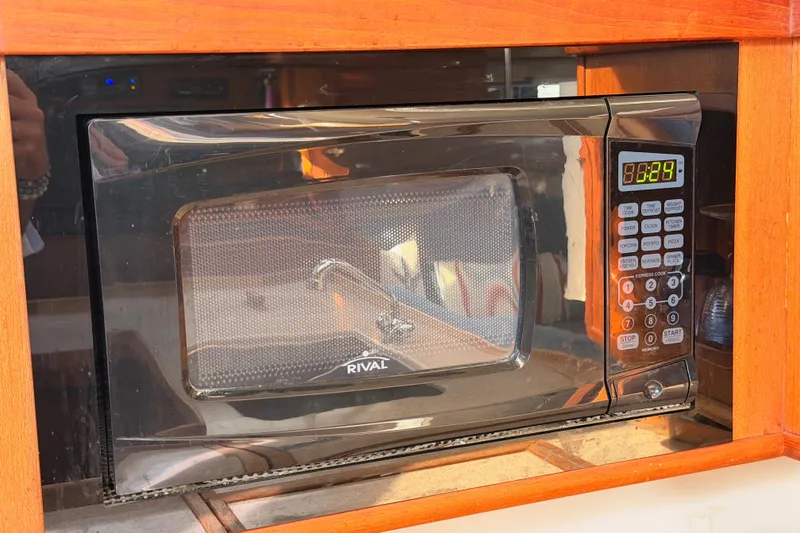 Slide: The Image of Rival microwave in a 1998 Hunter Legend 40.5 yacht kitchen setting. - 39