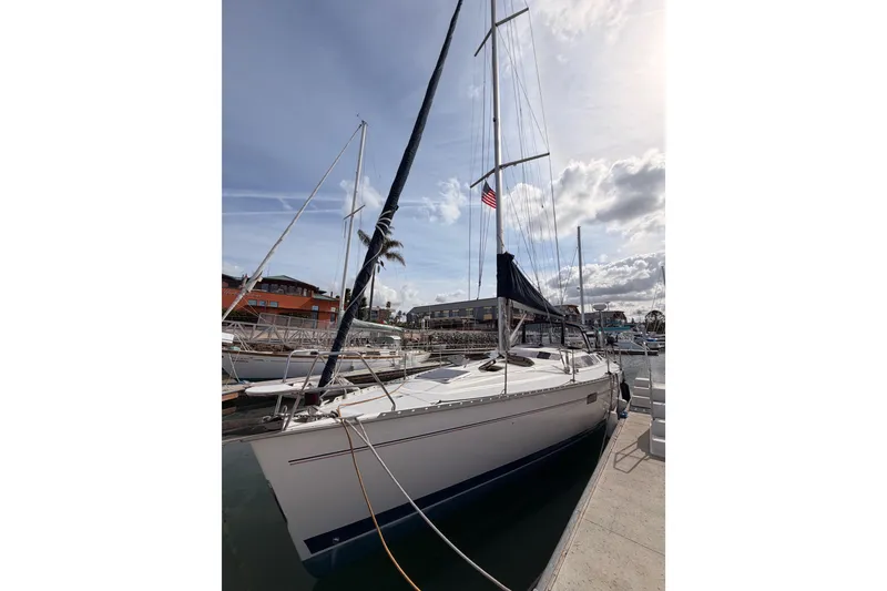 Slide: The Image of Sailboat docked at marina, 1998 Hunter Legend 40.5, under a partly cloudy sky. - 4