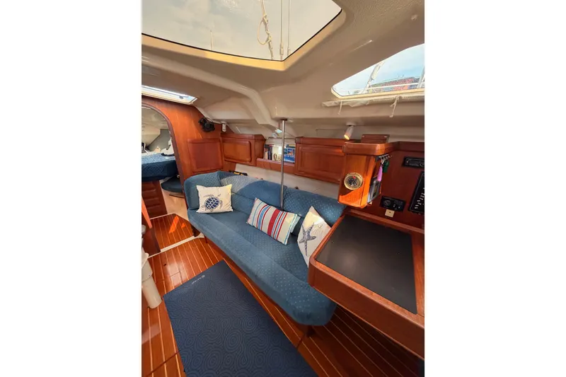 Slide: The Image of Interior of 1998 Hunter Legend 40.5 yacht with cozy seating and wooden accents. - 50
