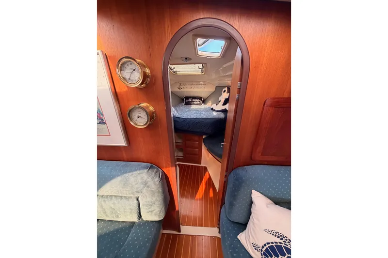 Slide: The Image of Interior of 1998 Hunter Legend 40.5 sailboat with cozy cabin and nautical decor. - 53