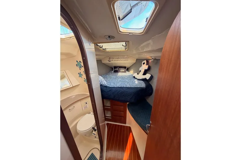 Slide: The Image of Cozy cabin interior of 1998 Hunter Legend 40.5 sailboat with nautical decor. - 54