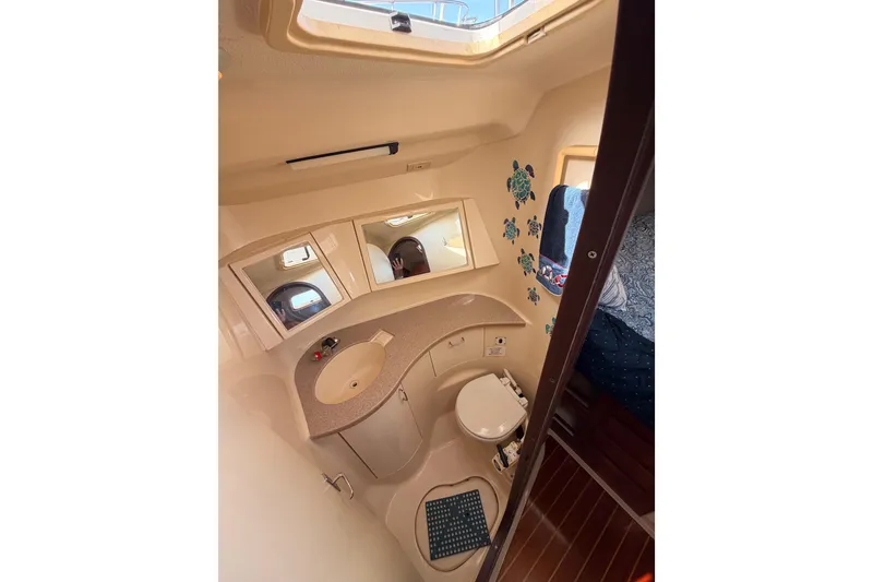 Slide: The Image of Bathroom interior of 1998 Hunter Legend 40.5 yacht with sink and toilet. - 55
