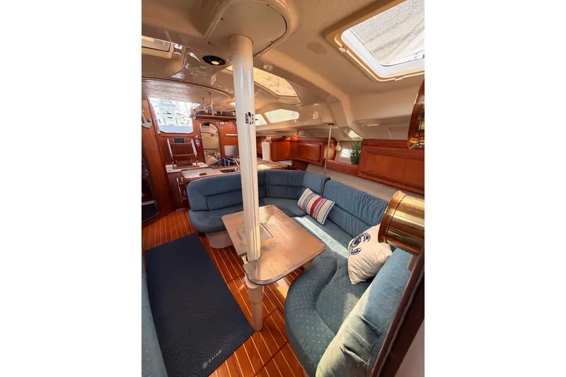Slide: The Image of Interior of 1998 Hunter Legend 40.5 yacht with cozy seating and wooden accents. - 60