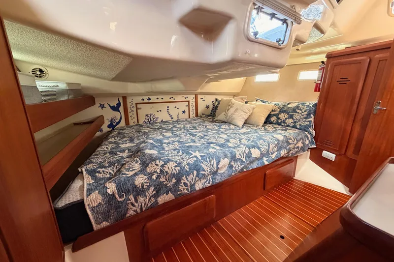 Slide: The Image of Cozy cabin interior of 1998 Hunter Legend 40.5 sailboat with nautical decor. - 65