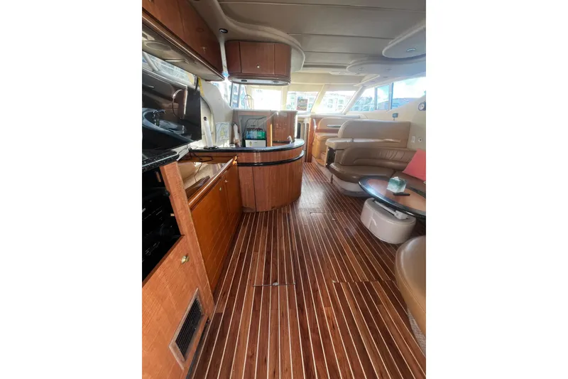 Slide: The Image of Luxurious interior of 2001 Maxum 4600 SCB yacht with wood flooring and elegant furnishings. - 13