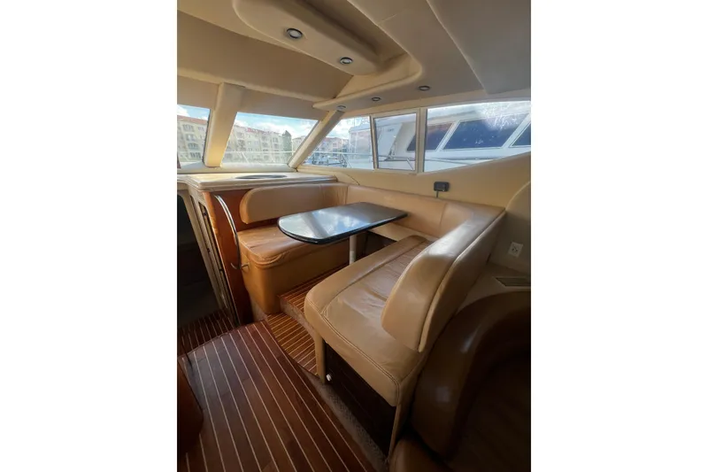 Slide: The Image of Luxurious interior of 2001 Maxum 4600 SCB yacht with leather seating and wooden flooring. - 14