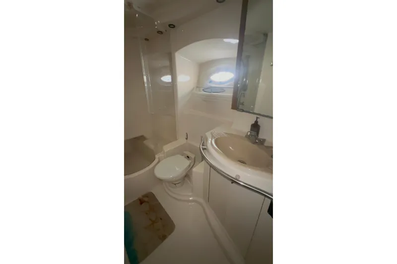 Slide: The Image of Bathroom interior of 2001 Maxum 4600 SCB Limited Edition yacht, featuring sink and toilet. - 17