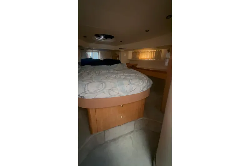 Slide: The Image of Interior cabin of 2001 Maxum 4600 SCB Limited Edition yacht with bed and window. - 18