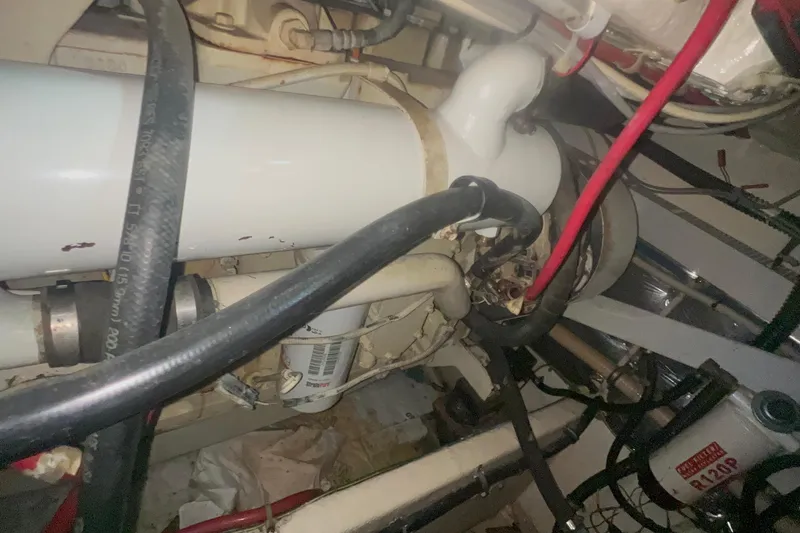 Slide: The Image of Engine compartment of a 2001 Maxum 4600 SCB Limited Edition boat, showing hoses and components. - 22