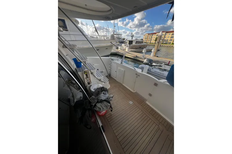 Slide: The Image of 2001 Maxum 4600 SCB Limited Edition yacht docked at marina with clear sky. - 8