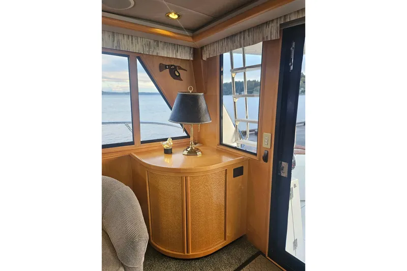 Slide: The Image of Interior of a 1995 Symbol 55 yacht with wooden cabinetry and ocean view. - 12