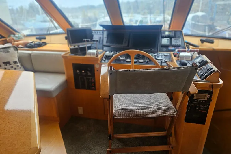 Slide: The Image of Cozy boat cockpit with control panel, chair, and panoramic windows, Symbol 55, 1995 model. - 22