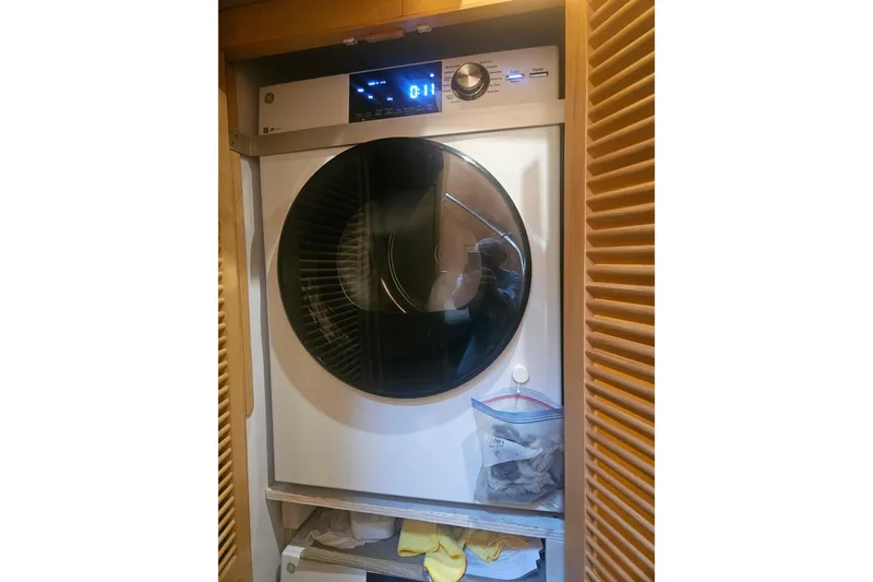 Slide: The Image of Front-loading washing machine in a wooden cabinet, Symbol 55 model, 1995. - 24