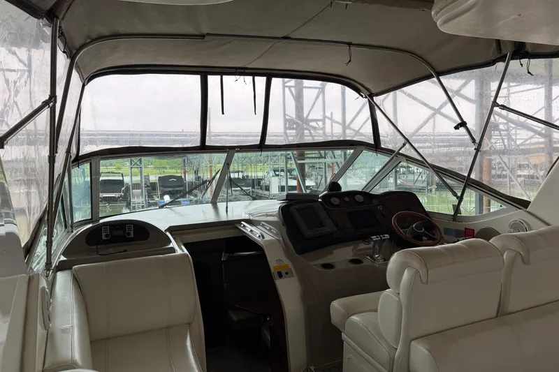 Slide: The Image of Interior view of 2003 Cruisers Yachts 405 Express Motoryacht cockpit with helm and seating. - 10