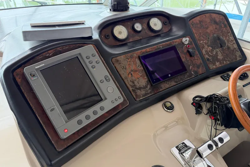 Slide: The Image of Dashboard of 2003 Cruisers Yachts 405 Express Motoryacht with navigation equipment. - 13