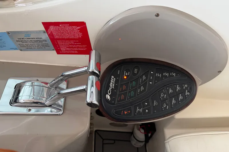 Slide: The Image of Control panel of a 2003 Cruisers Yachts 405 Express Motoryacht with throttle levers. - 17