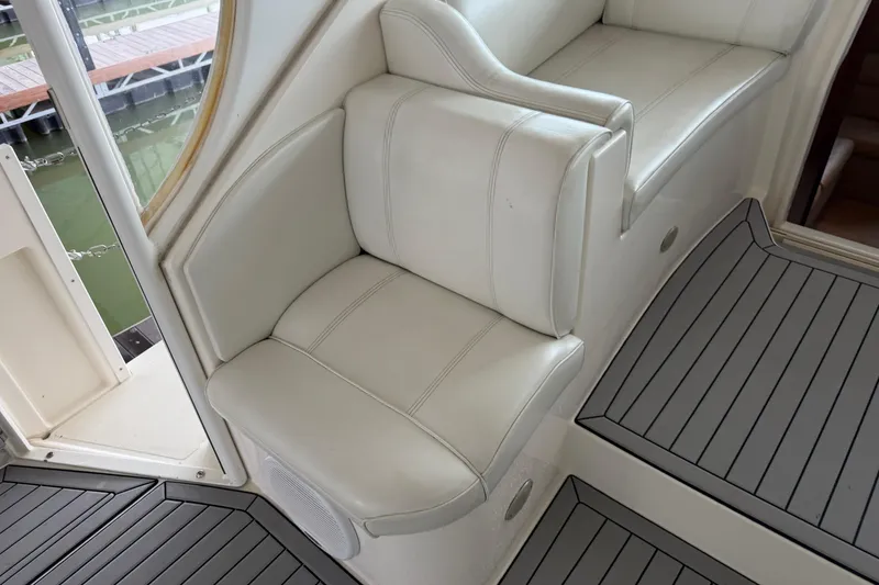 Slide: The Image of 2003 Cruisers Yachts 405 Express Motoryacht interior with white leather seating and sleek flooring. - 25