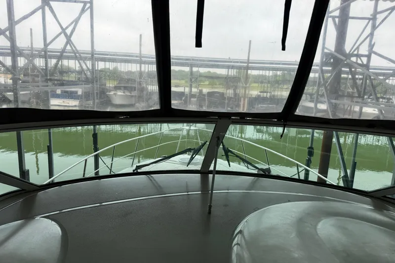 Slide: The Image of 2003 Cruisers Yachts 405 Express Motoryacht docked, viewed from the helm. - 27