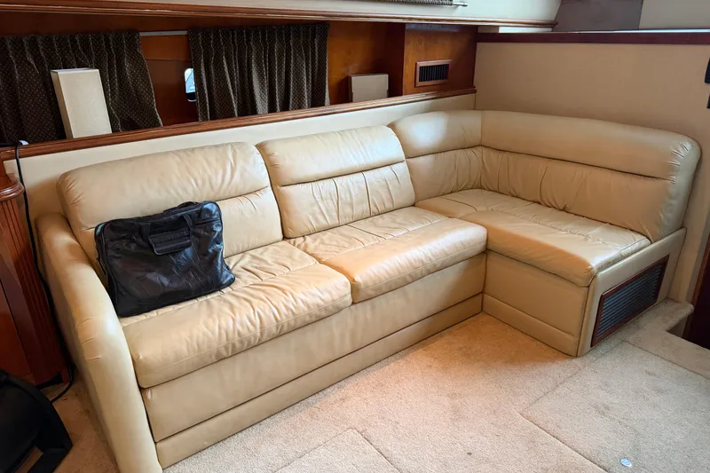 Slide: The Image of Luxurious beige leather sofa in 2003 Cruisers Yachts 405 Express Motoryacht interior. - 29