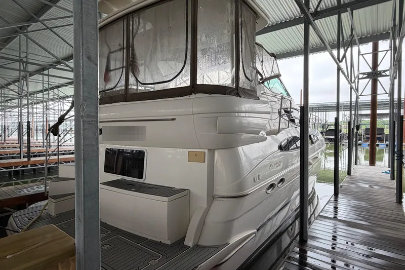 Slide: The Image of 2003 Cruisers Yachts 405 Express Motoryacht docked in marina. - 3