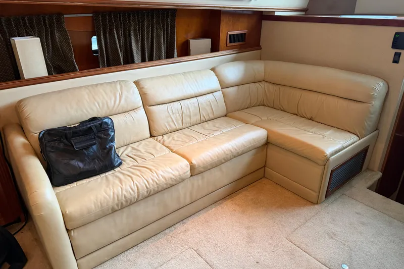Slide: The Image of Luxurious beige leather sofa in 2003 Cruisers Yachts 405 Express Motoryacht interior. - 31