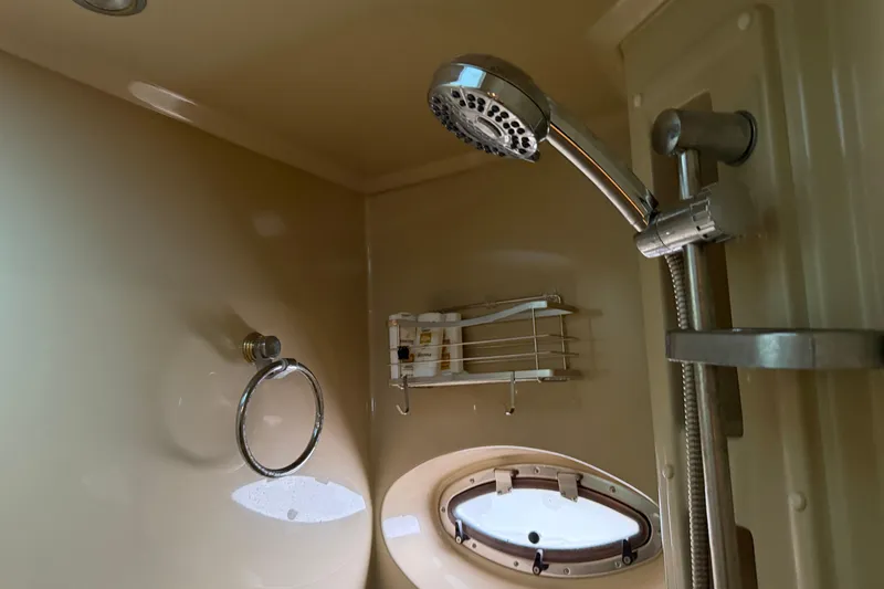 Slide: The Image of Shower area in 2003 Cruisers Yachts 405 Express Motoryacht with porthole and fixtures. - 45