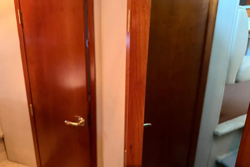 Slide: The Image of Interior view of 2003 Cruisers Yachts 405 Express Motoryacht with wooden doors. - 46