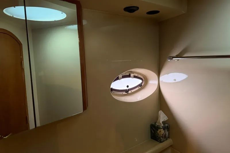 Slide: The Image of Bathroom interior of 2003 Cruisers Yachts 405 Express Motoryacht with porthole and mirror. - 48